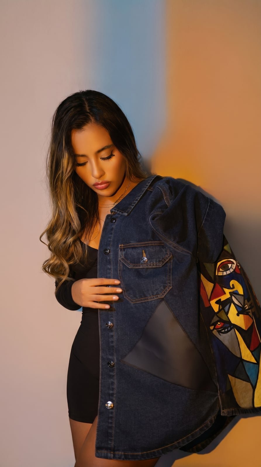 Model wearing a hand painted SarArt jacket in an urban setting